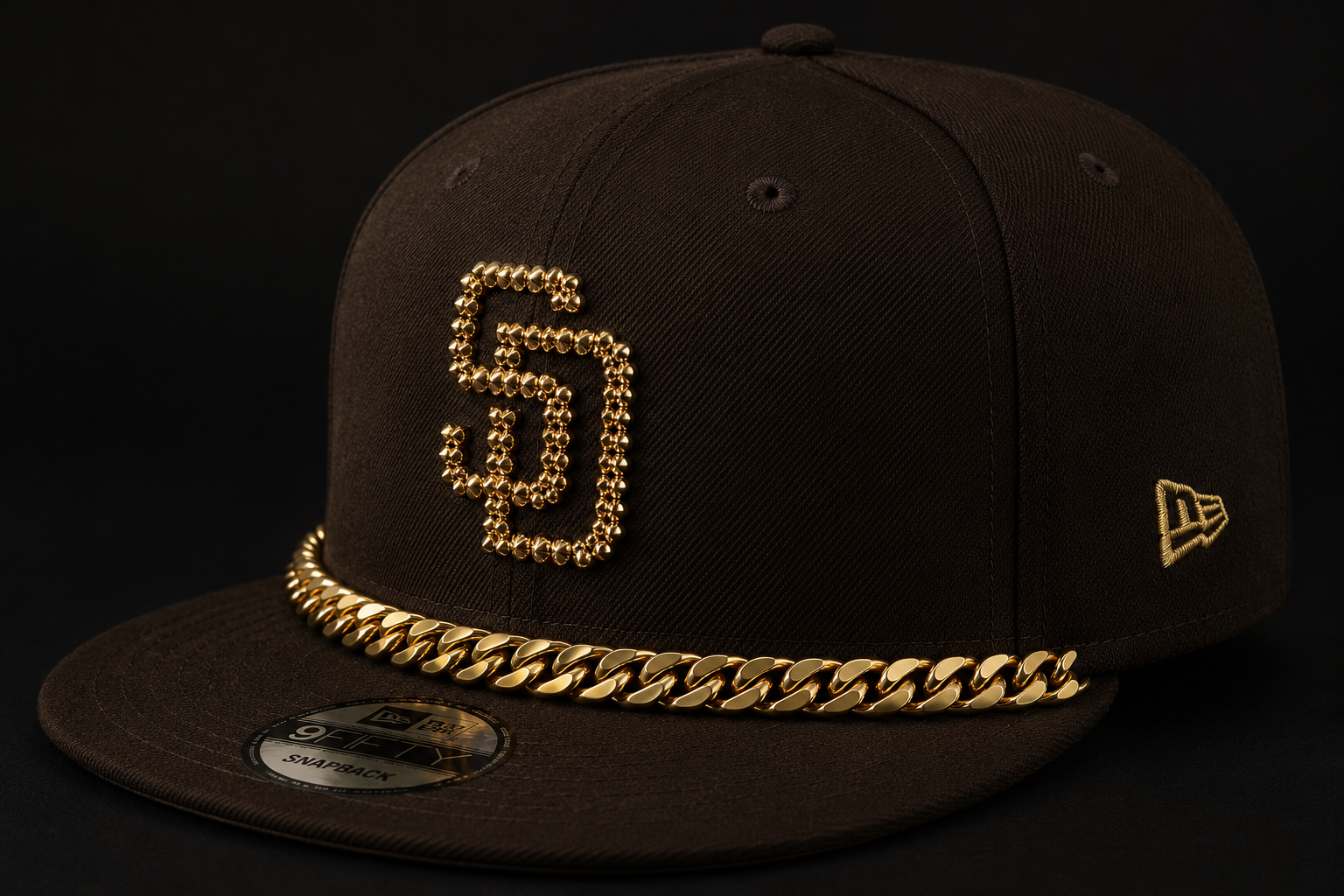 Black snapback with gold GP monogram and Cuban-link brim chain
